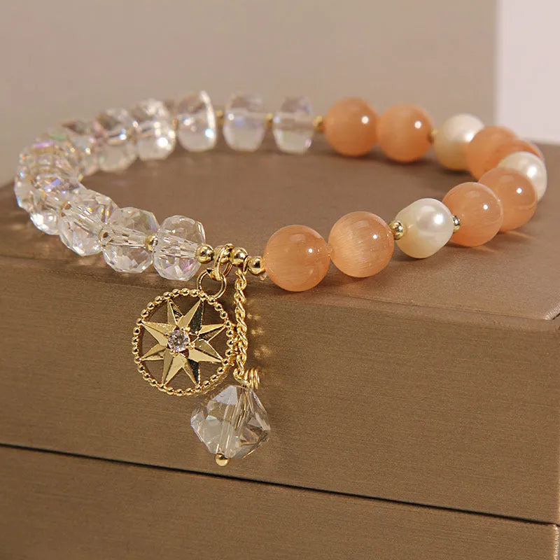 Orange women's bracelet with eight Awn star design featuring opal crystal and artificial gemstone inlay on gold-plated metal