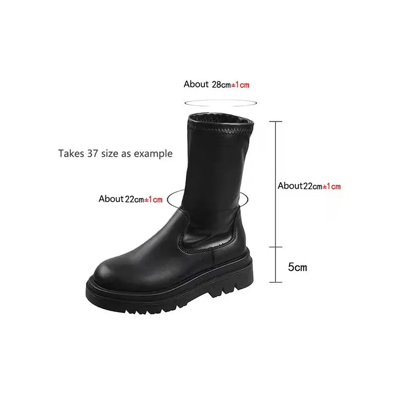 Black women's knee high boots with thick chunky sole and round toe on a winter background