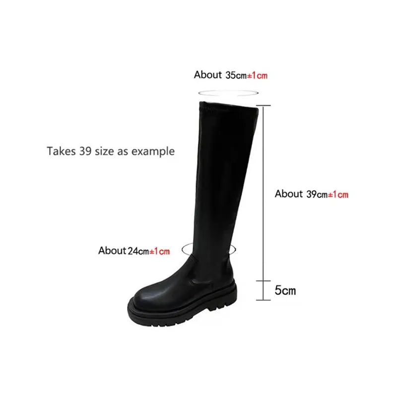 Black women's knee high boots with thick chunky sole and round toe on a winter background