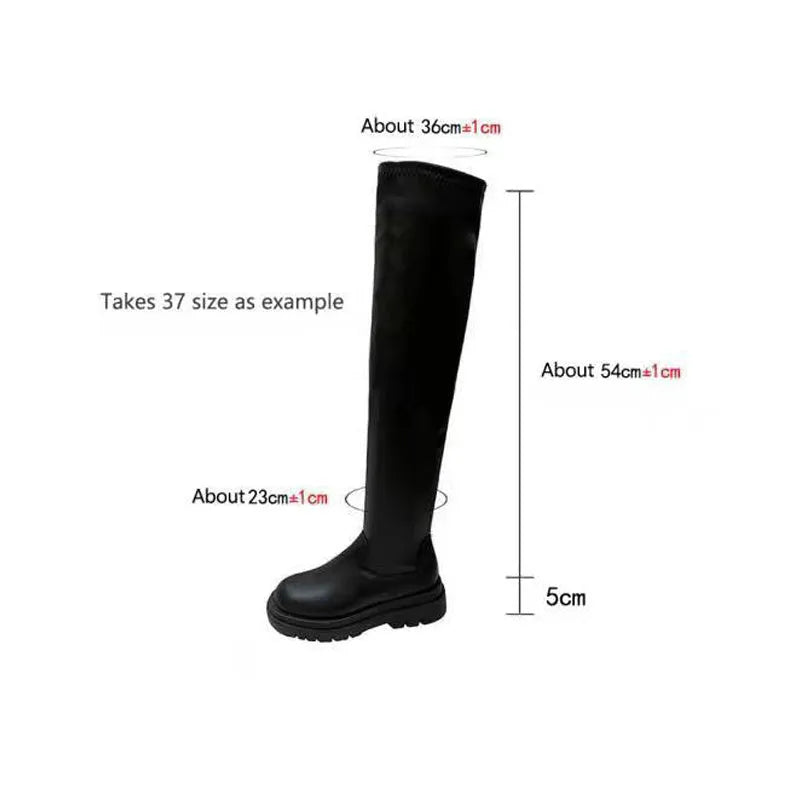 Black women's knee high boots with thick chunky sole and round toe on a winter background