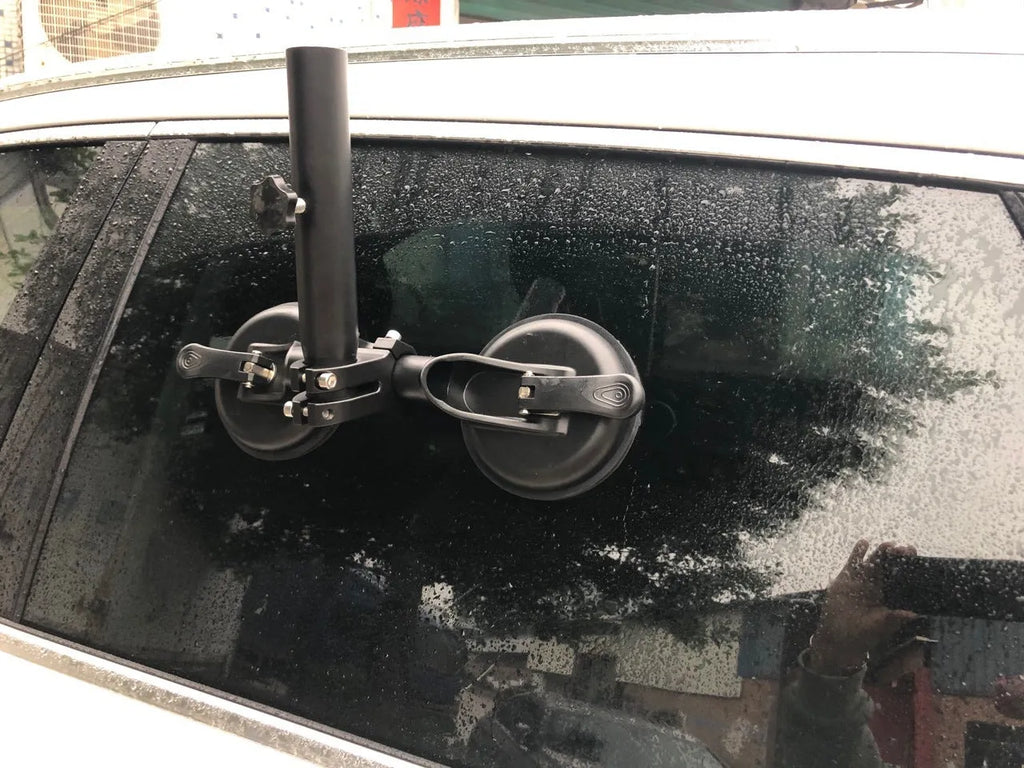 Black ABS off-road car sucker base with a round rubber sucker for mounting flagpoles on vehicle glass.