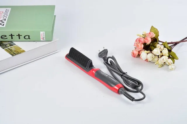 Black and red ceramic hair straightening brush with heated teeth and LED display on white background