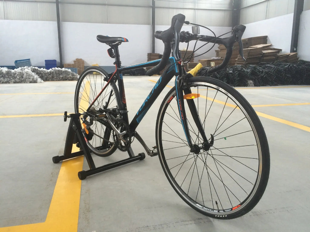 Indoor cycling training platform with magnetoresistance line control and fixed parking frame for 66-69cm bikes, black