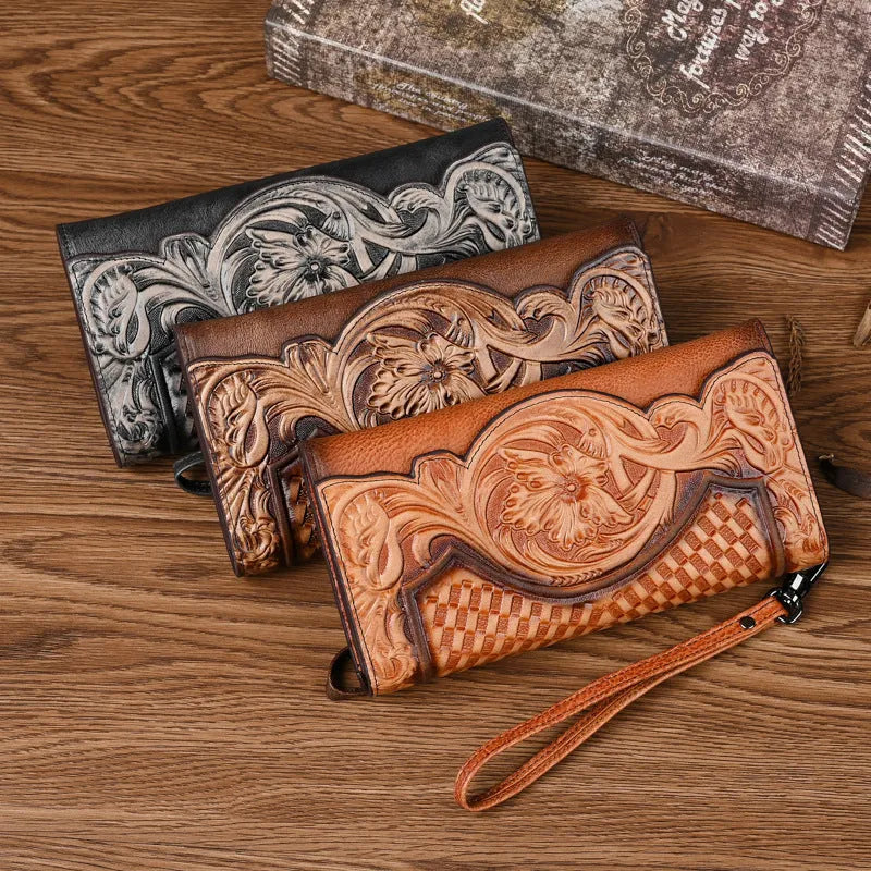 Brown tri-fold leather wallet with deep embossed floral pattern, shown open to reveal card slots and lining.