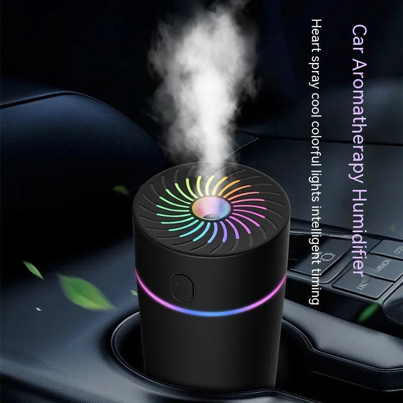 A compact white USB car humidifier for aromatherapy and air humidifying, shown with a power cable.