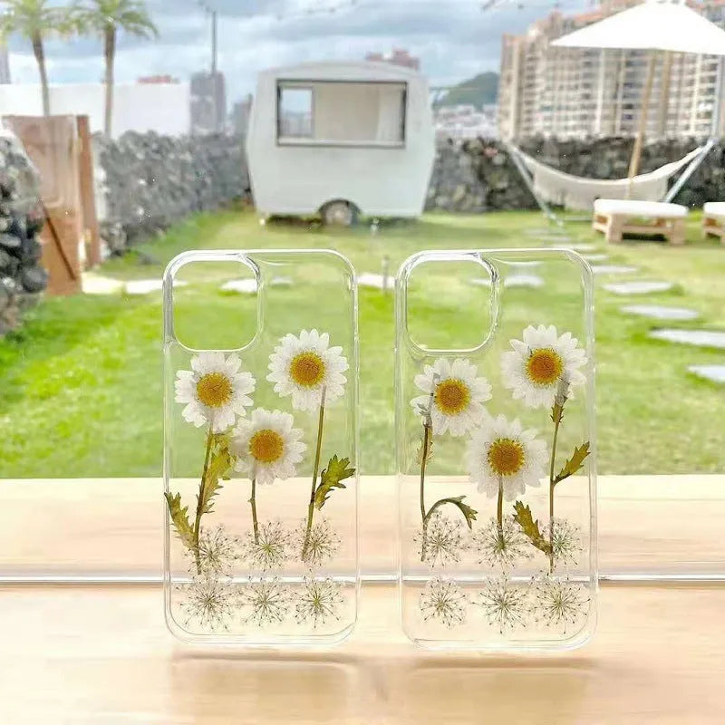 White epoxy daisy floral design TPU phone case for iPhone, showing back cover.