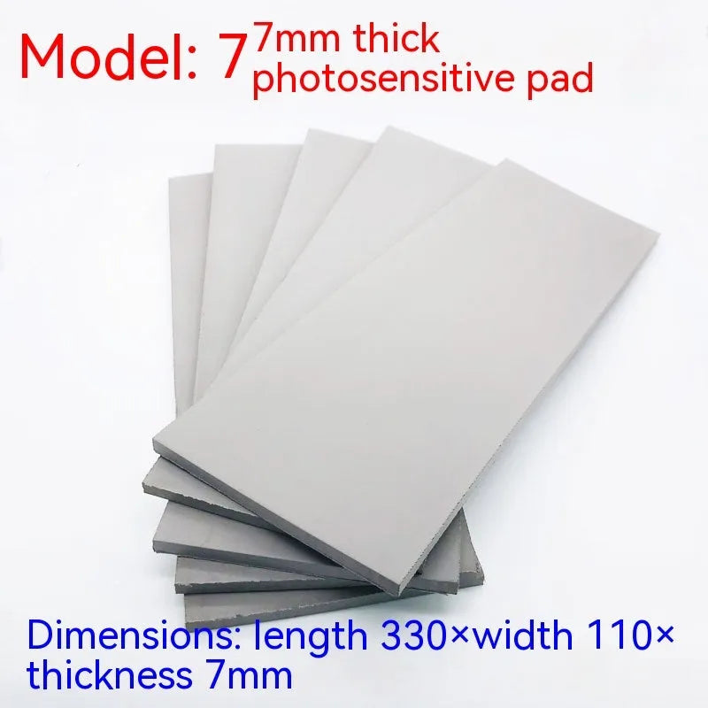 Black and grey plastic photosensitive mat for seal making in pottery and calligraphy.