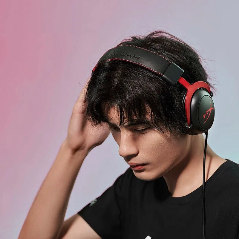 Hurricane 2 wired over-ear gaming headset in black and red, showing detachable microphone and USB sound card remote.