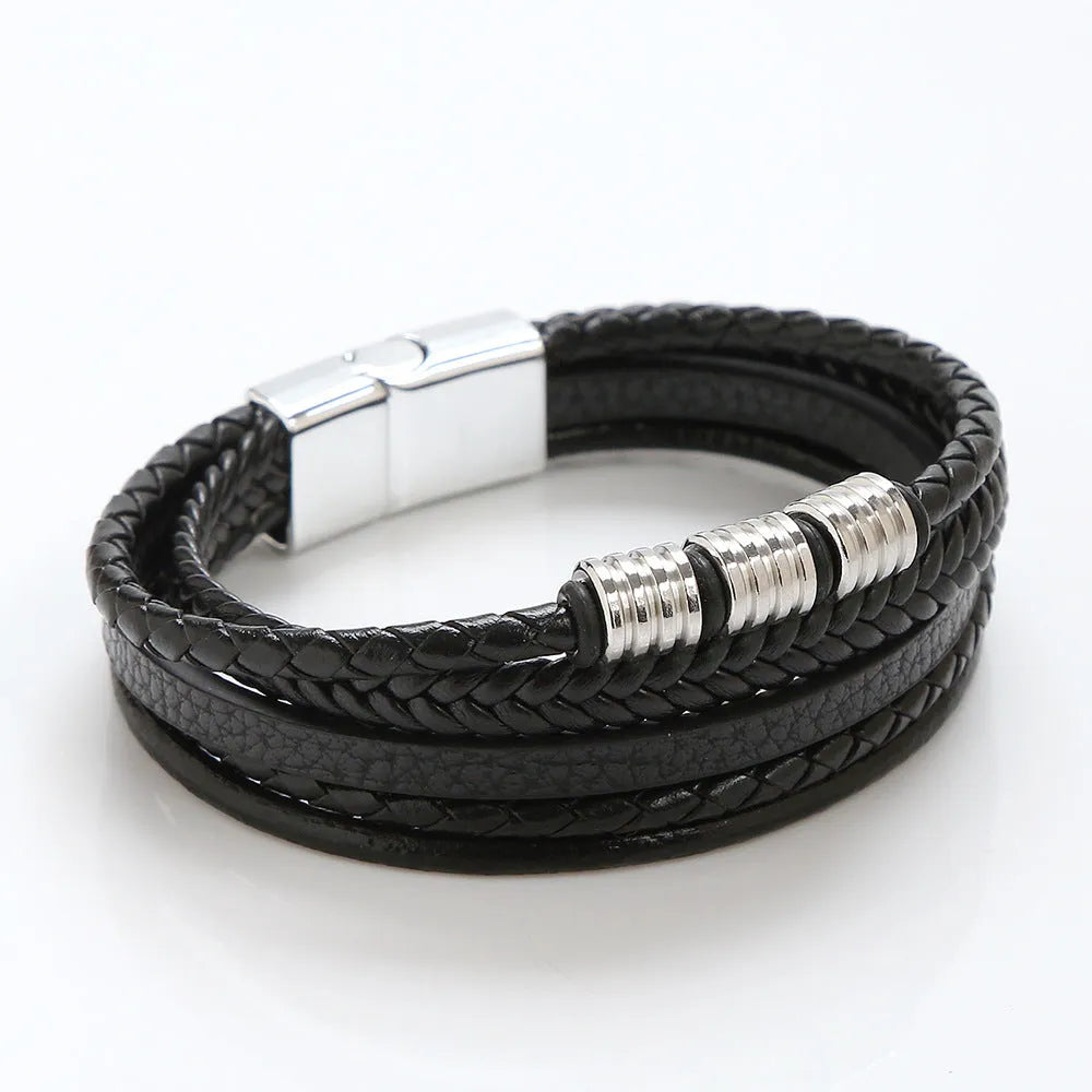 Men's woven leather bracelet with alloy magnetic buckle, geometric design, electroplated finish, in black or brown.