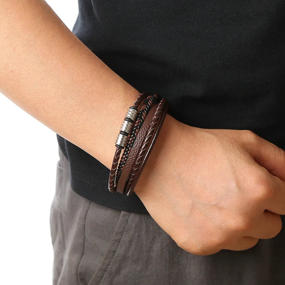 Men's woven leather bracelet with alloy magnetic buckle, geometric design, electroplated finish, in black or brown.