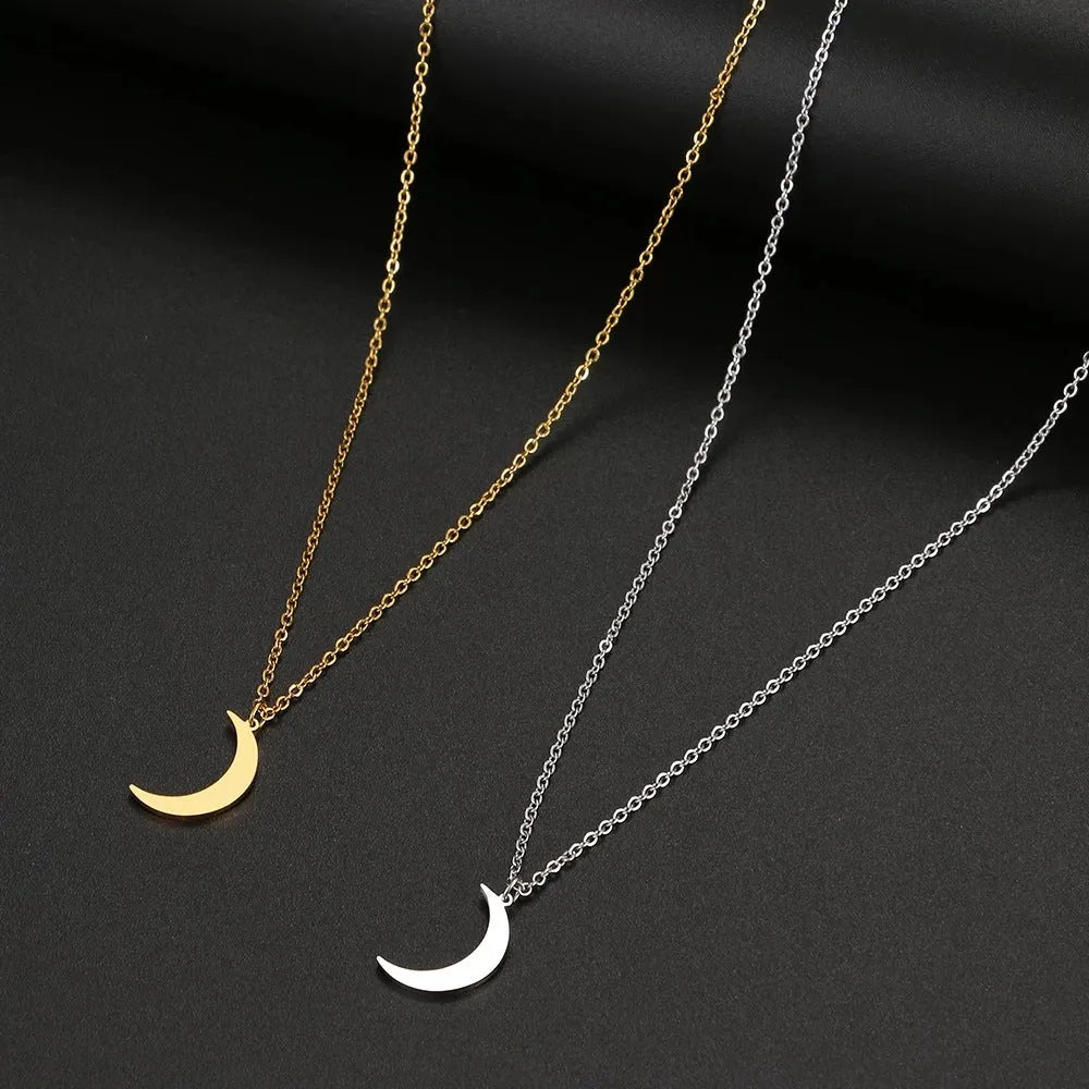 Women's stainless steel moon pendant necklace on a clavicle chain in gold or silver electroplated finish
