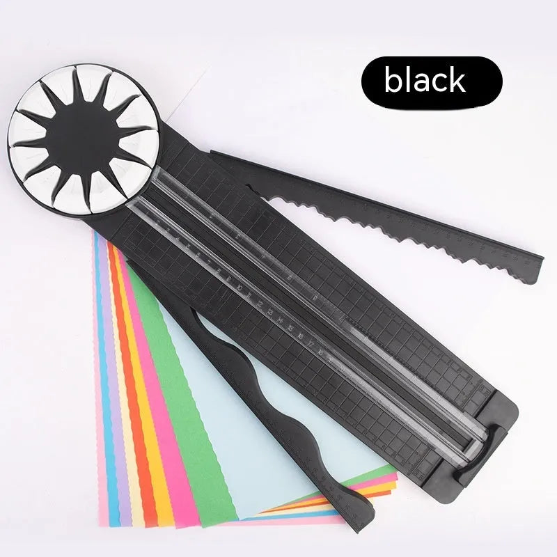 Pink plastic 12-in-1 paper cutting machine with dotted line and other pattern guides on a flat surface.