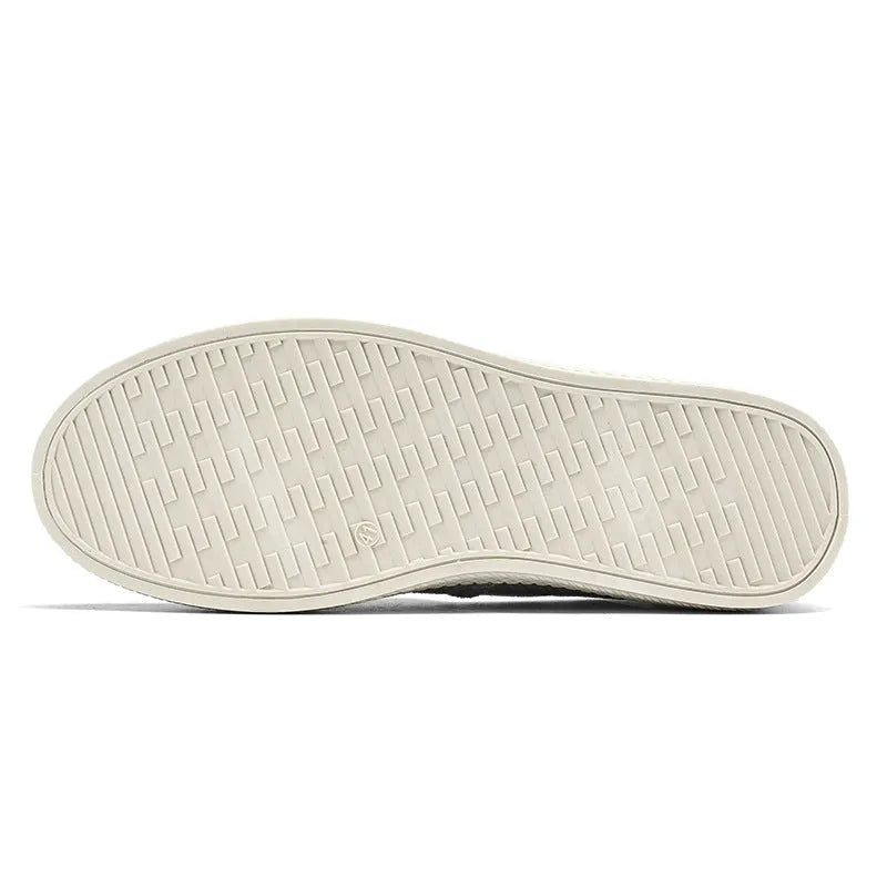 Men's beige canvas slip-on shoes with round toe and PVC sole on neutral background