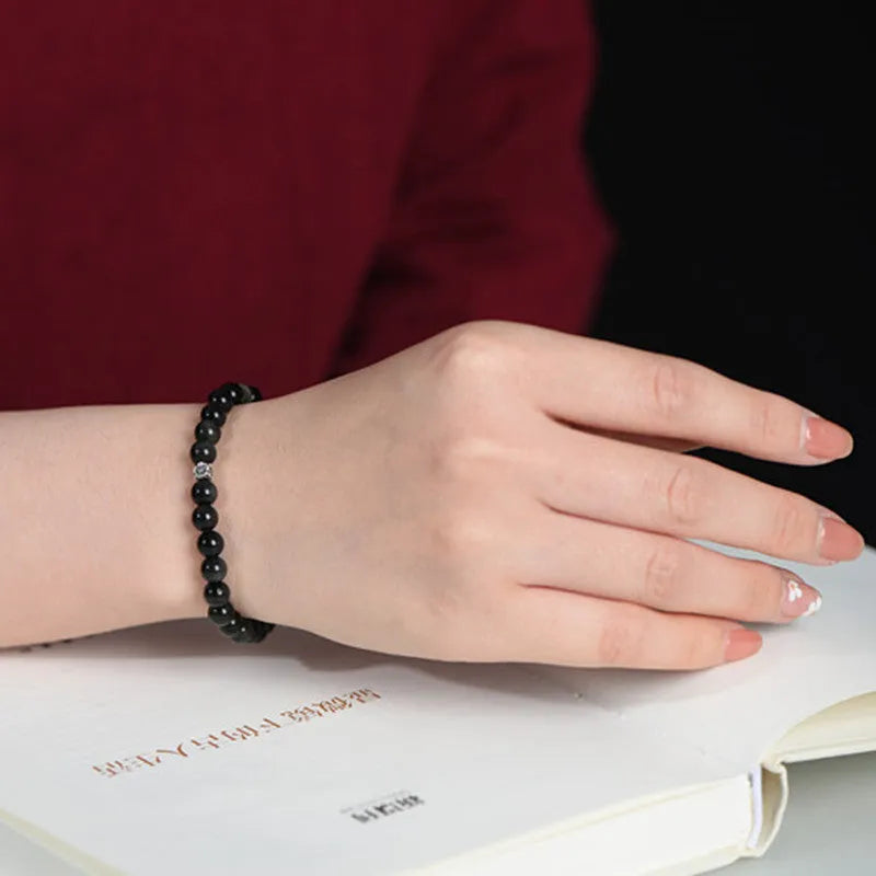 Natural obsidian bracelet with S925 silver flower charm and dragon phoenix decorations