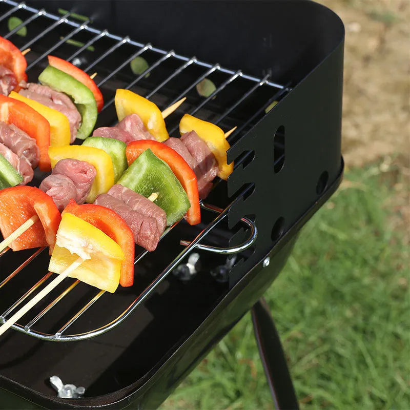 Portable metal barbecue oven with black grill rack, 29x12x44cm, for camping and outdoor use, serving 3-5 people.