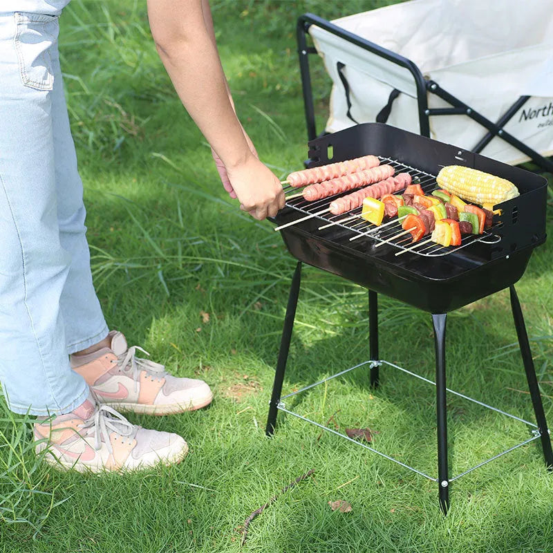 Portable metal barbecue oven with black grill rack, 29x12x44cm, for camping and outdoor use, serving 3-5 people.
