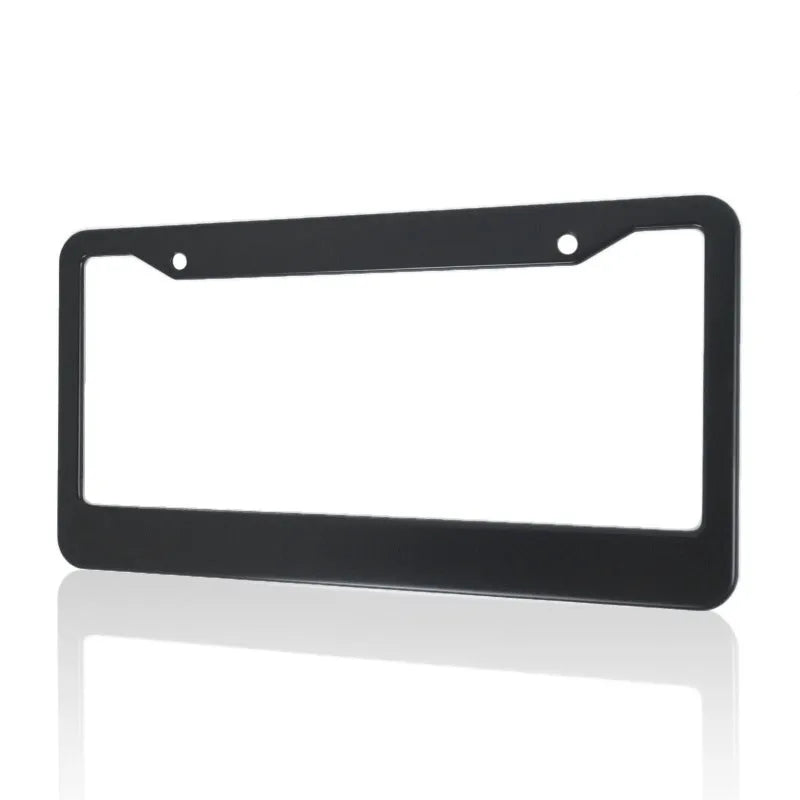 Minimalist black aluminium licence plate frame for American Standard cars, showing round hole design.