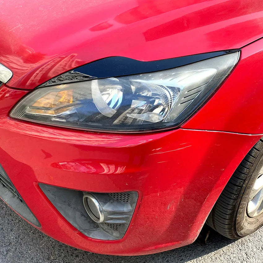 Ford Focus headlight eyebrow stickers in carbon fibre pattern and piano black options