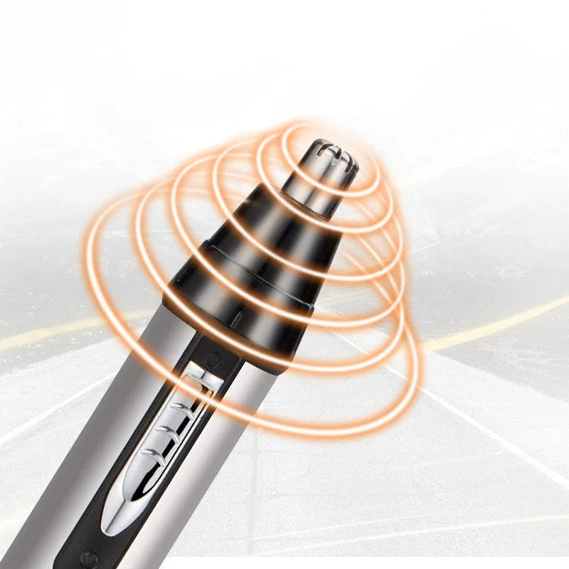 White male electric nose hair trimmer with charging base and four heads on a table