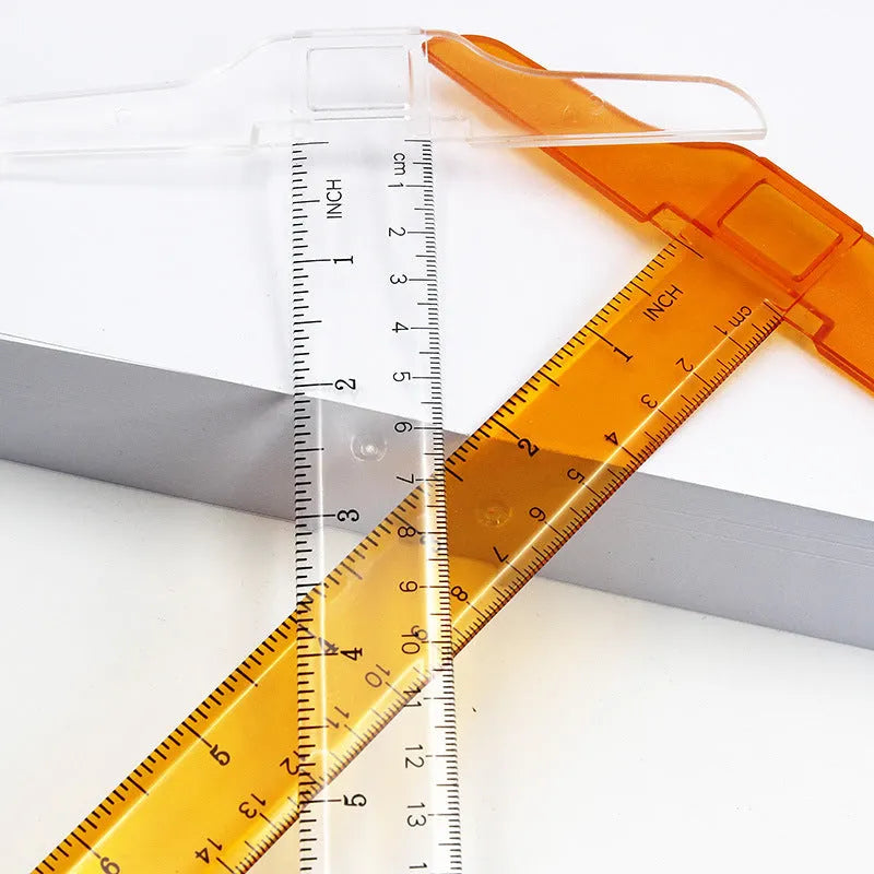Orange yellow and transparent plastic T-square rulers measuring 30cm for design and drafting.