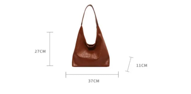 Soft black PU leather women's shoulder bag with large capacity and visible sewing thread detail.