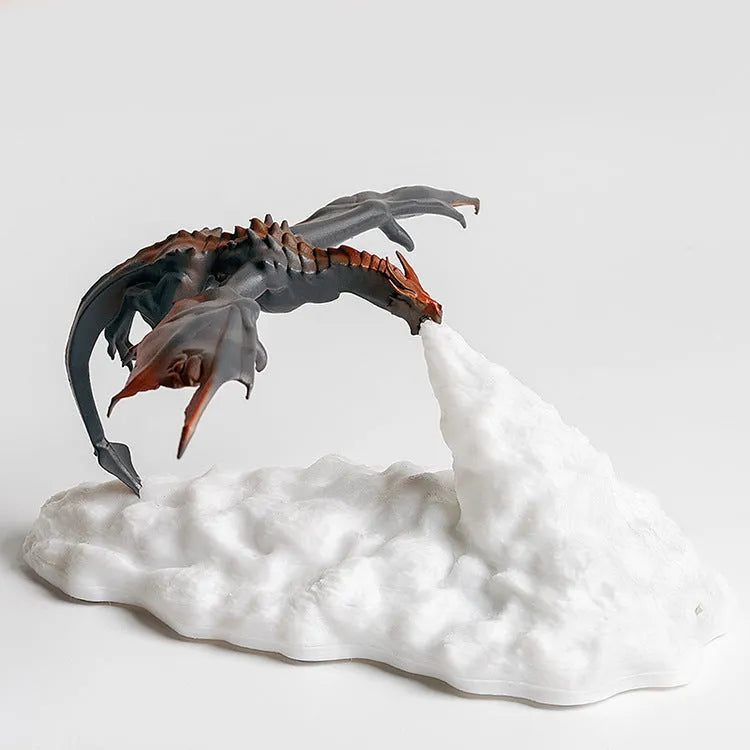 3D printed red dragon night light glowing on a bedside table