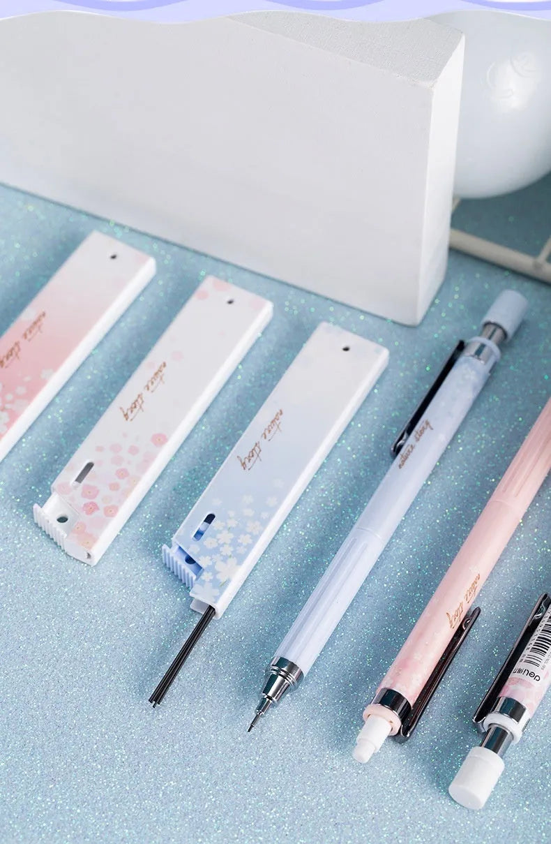 Sakura law cartoon style automatic pencil set with three coloured pencils and boxes of 0.5mm HB refills.