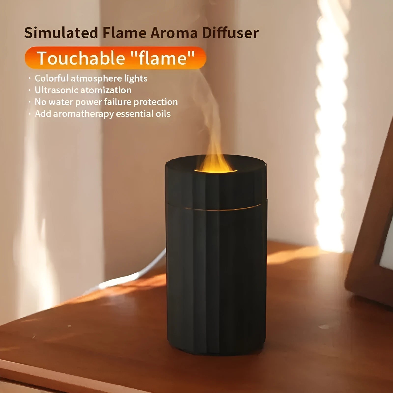 Black portable USB air humidifier and essential oil diffuser with glowing LED flame effect on a table