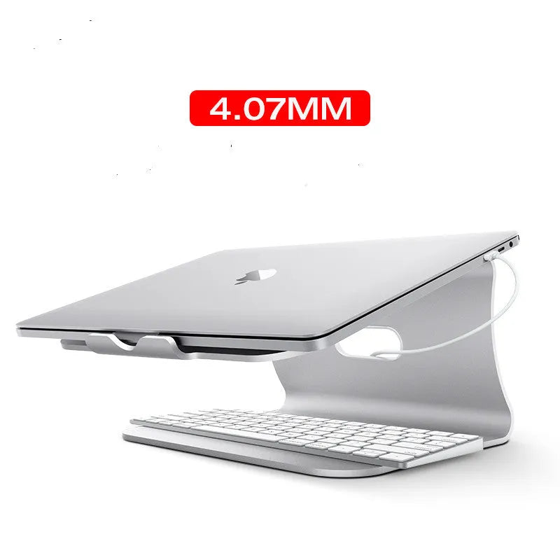 Silver aluminium laptop cooling stand with striped design on a wooden desk, rotated to show profile.