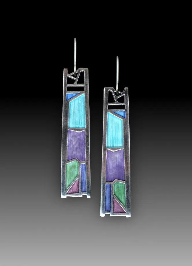 Silver coloured women's earrings with an irregular water drop shape made from alloy.