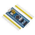 STM32F103C8T6 ARM Cortex-M3 microcontroller development board with blue PCB and pin headers.
