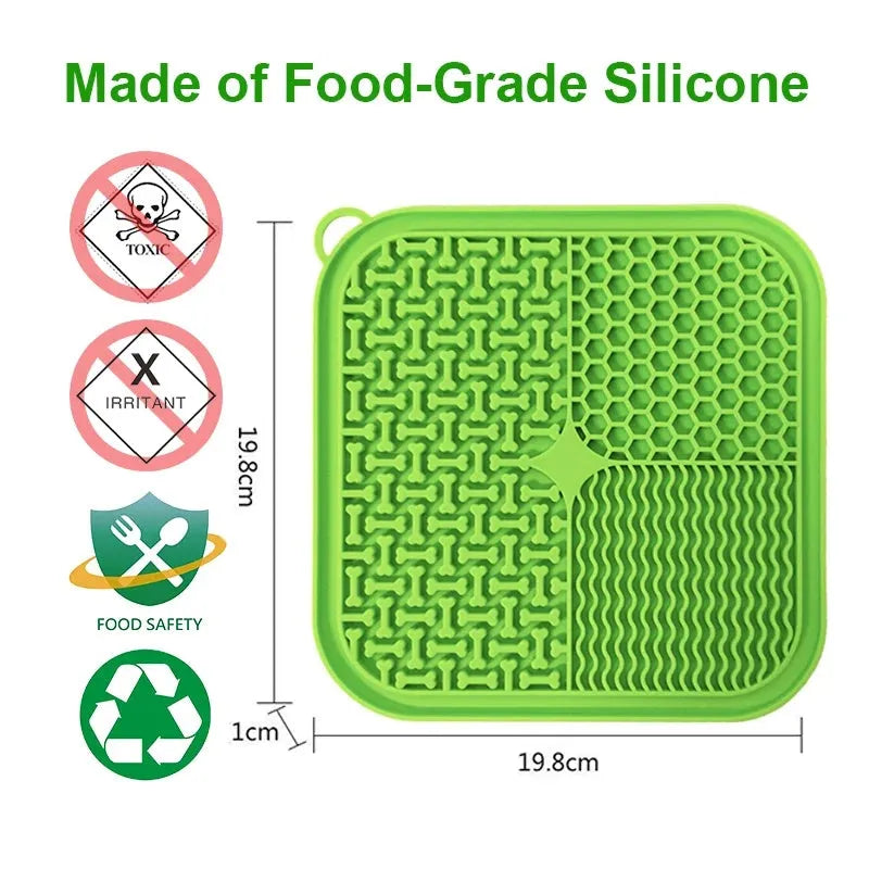 Orange, grey, blue and green silicone dog licking mat with suction cups on back measuring 20x20cm