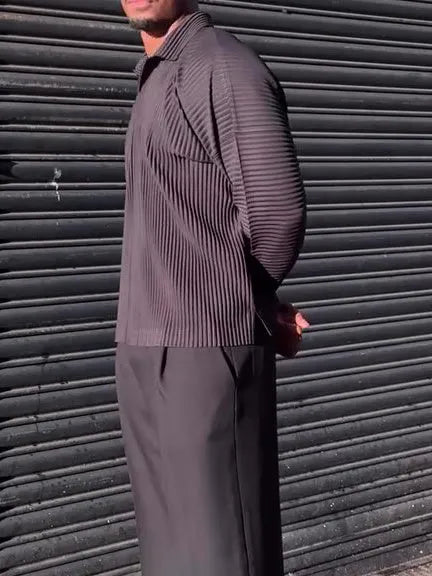 Man wearing a black pleated long-sleeved casual polyester top