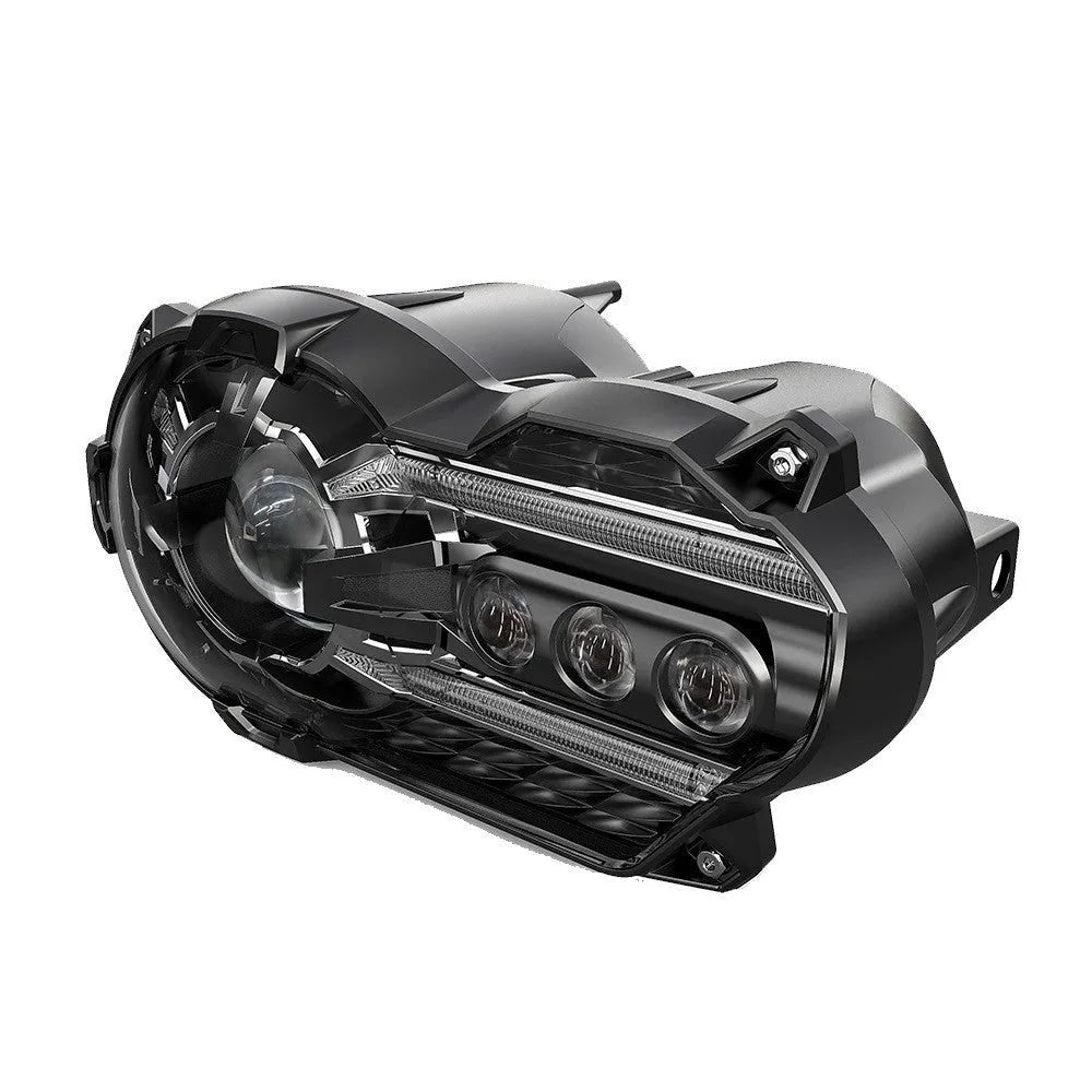 Black LED motorcycle headlight unit showing front lens and shell, with scale showing dimensions.