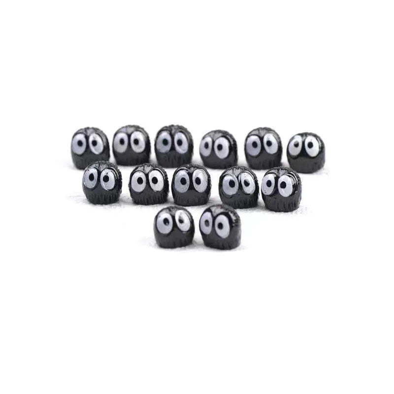 Small black resin cartoon coal ball car decoration with traceless adhesive tape.