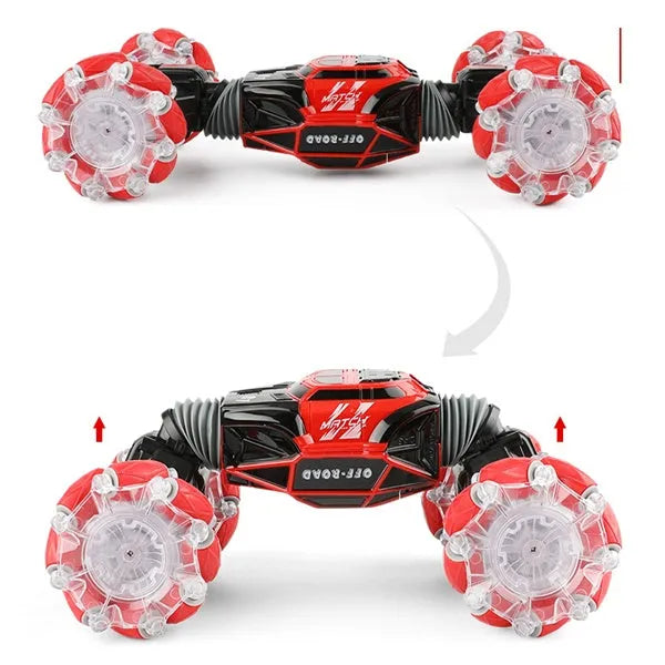 4WD RC stunt car with gesture remote control in red colour on white background showing off-road wheels and LED lights
