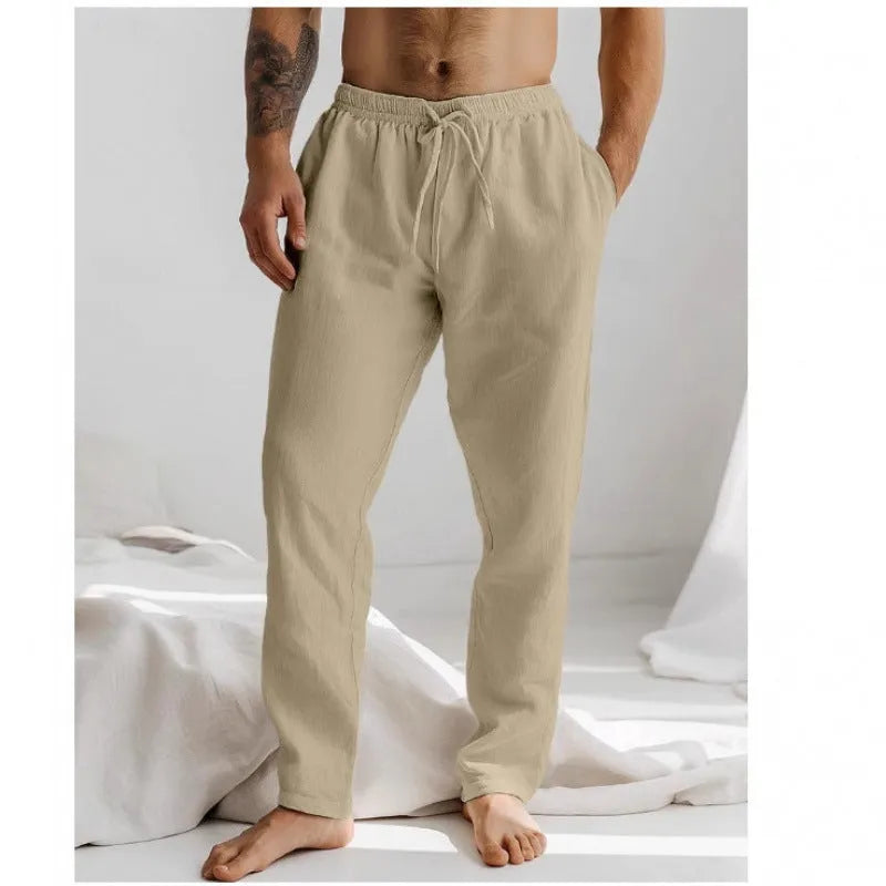 Men's light blue cotton linen loose-fit trousers with an elastic drawstring waist and straight legs.