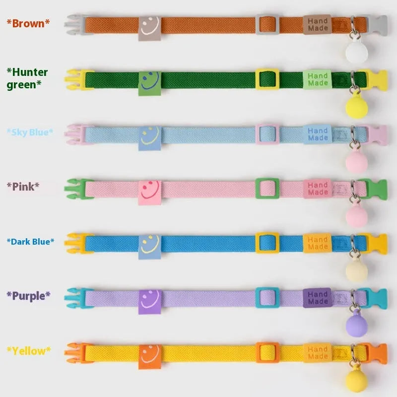 Small dog collar made of elastic polyester webbing with a plastic buckle, shown in a monochrome colour.
