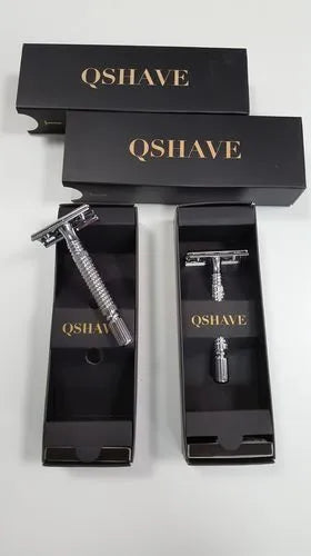Double edged safety razor and blade in a storage box, a traditional wet shaving kit.