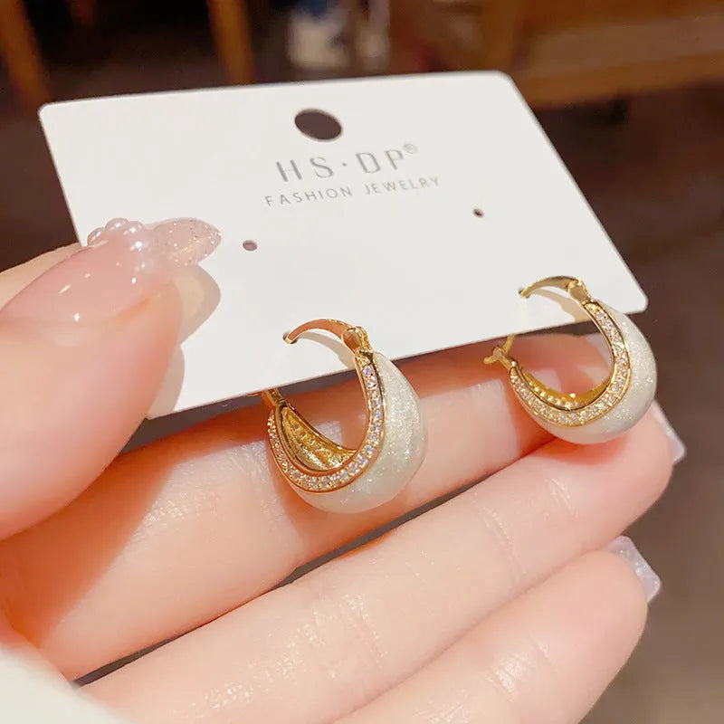 Pair of retro copper earrings with micro-inlaid drip oil design and thick real gold plating in geometric shape