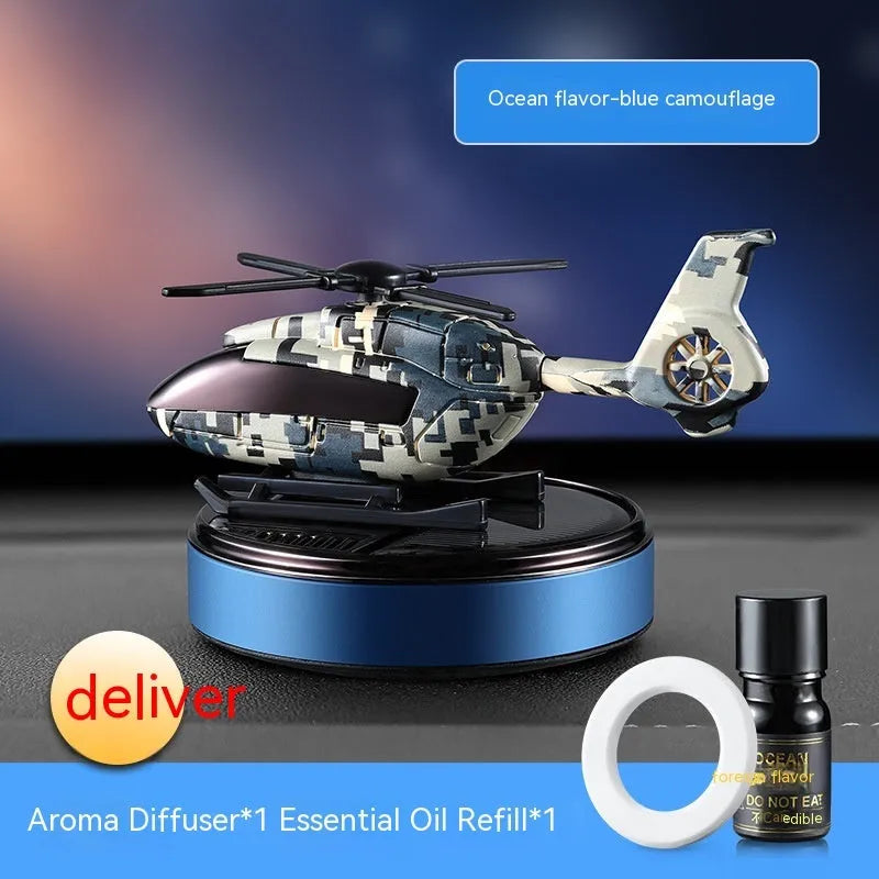 Solar-powered camouflage design car perfume and decoration unit on a car dashboard.
