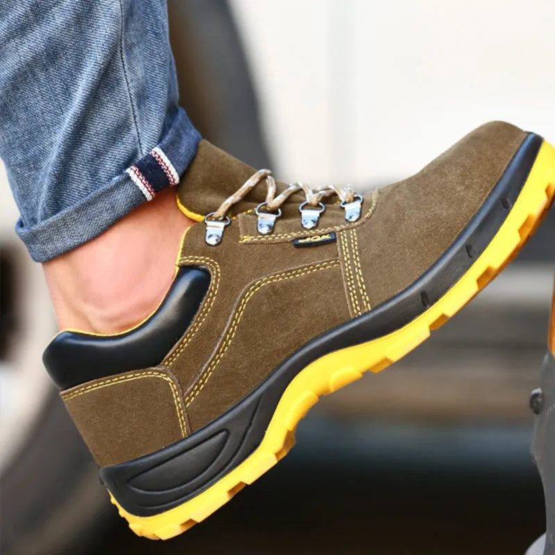 Bronze coloured low-cut cow suede leather safety shoes with a steel toe cap on a patterned non-slip sole.