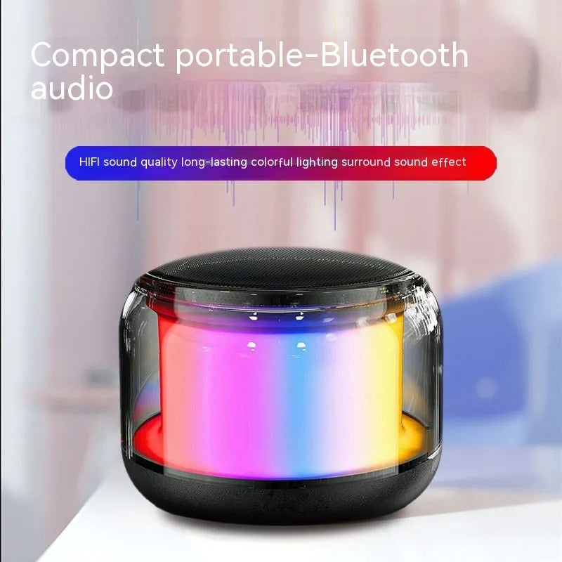 Black coloured glaze gun-shaped Bluetooth speaker with card slot on desktop