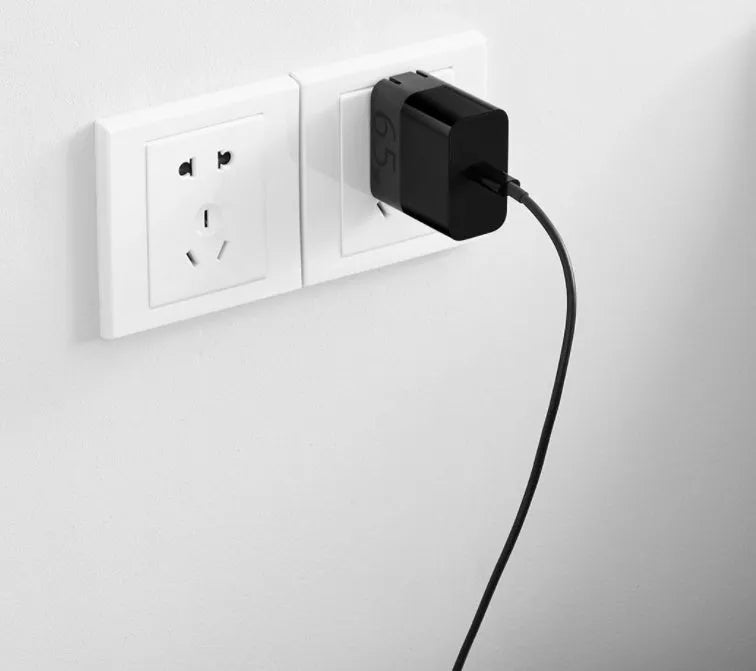 Black ZMI USB-C 65W notebook power adapter showing compact design