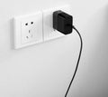 Black ZMI USB-C 65W notebook power adapter showing compact design