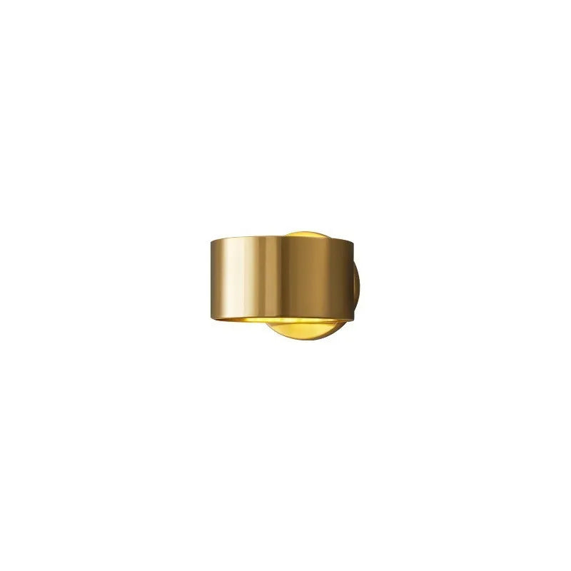 Modern simple style copper wall lamp in black or gold finish with plug.