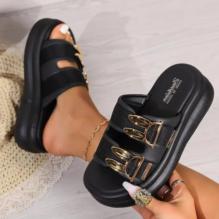 Women's apricot suede slippers with a thick, soft rubber sole on a light background.