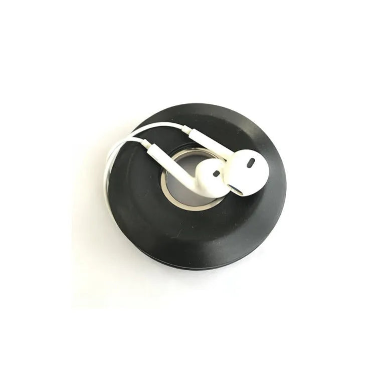 Silicone donut-shaped suction cup cord reel for organising phone and earphone cables