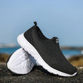 Pair of couple casual mesh shoes with PU mesh upper, hollow plaid detailing, and flat rubber sole in light gray, dark blue, black and white, or all black.