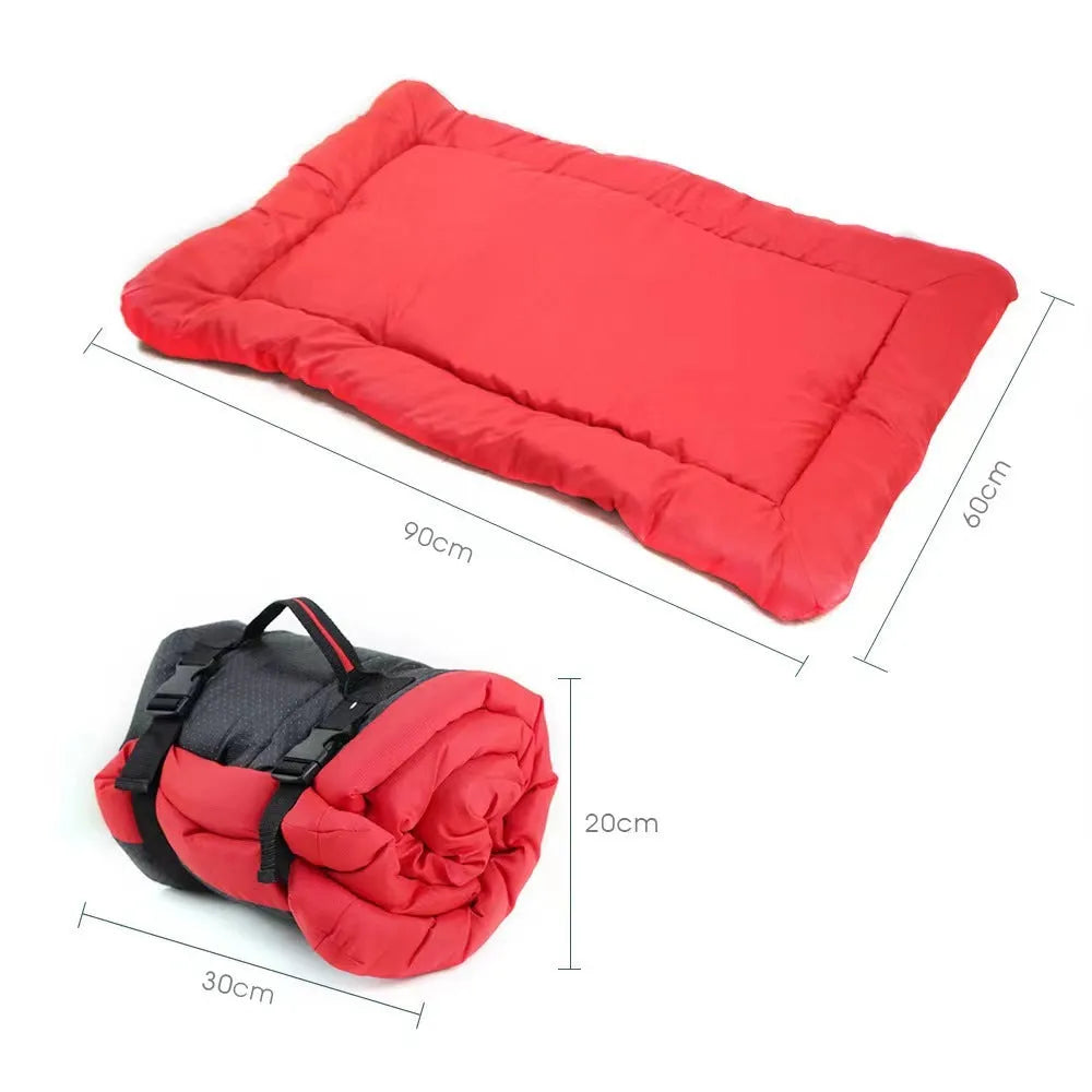Blue foldable waterproof dog bed shown both open and folded with nylon buckles, on grass.